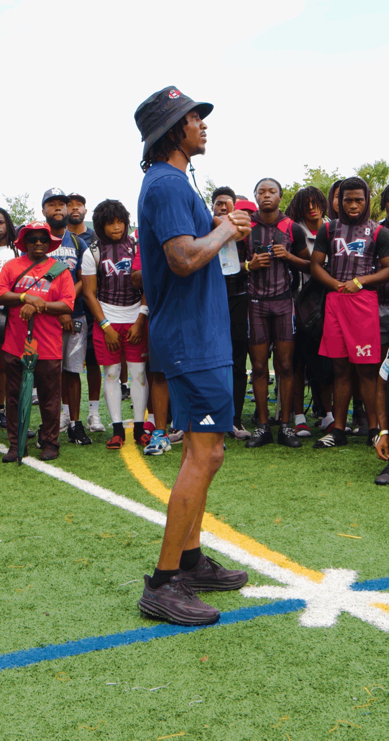 Tutu Atwell speaking with young athletes