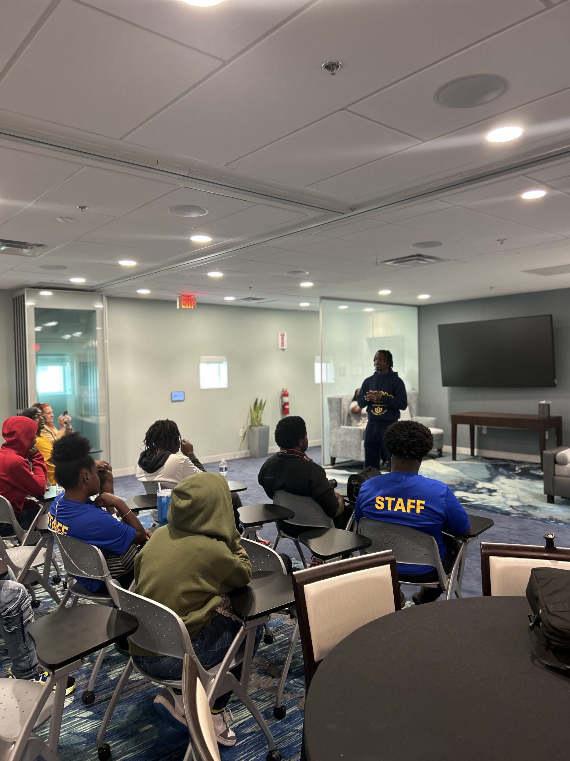 Tutu Atwell speaking to youth during a foundation wellness and mentorship workshop