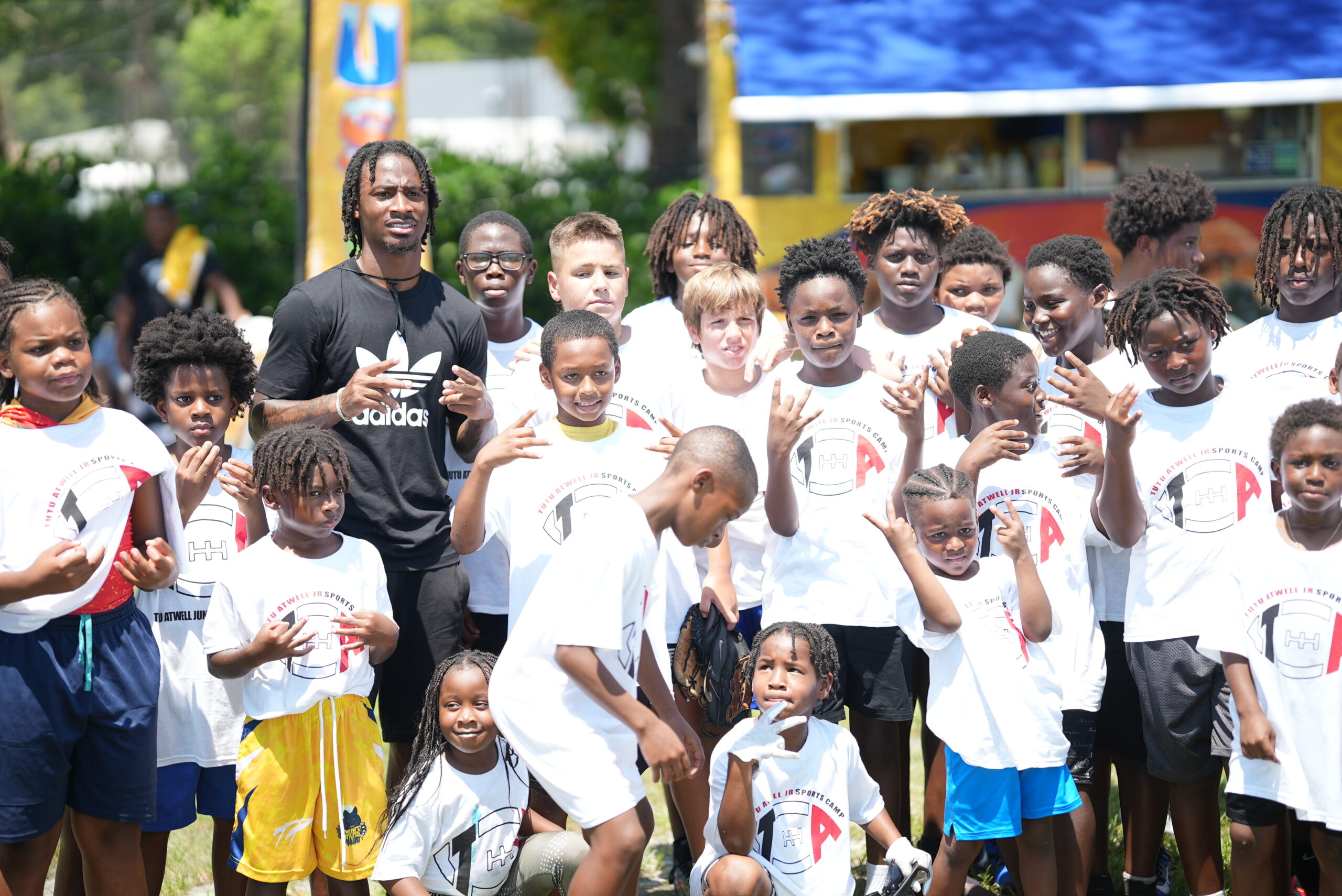 Tutu Atwell with youth participants at a foundation event
