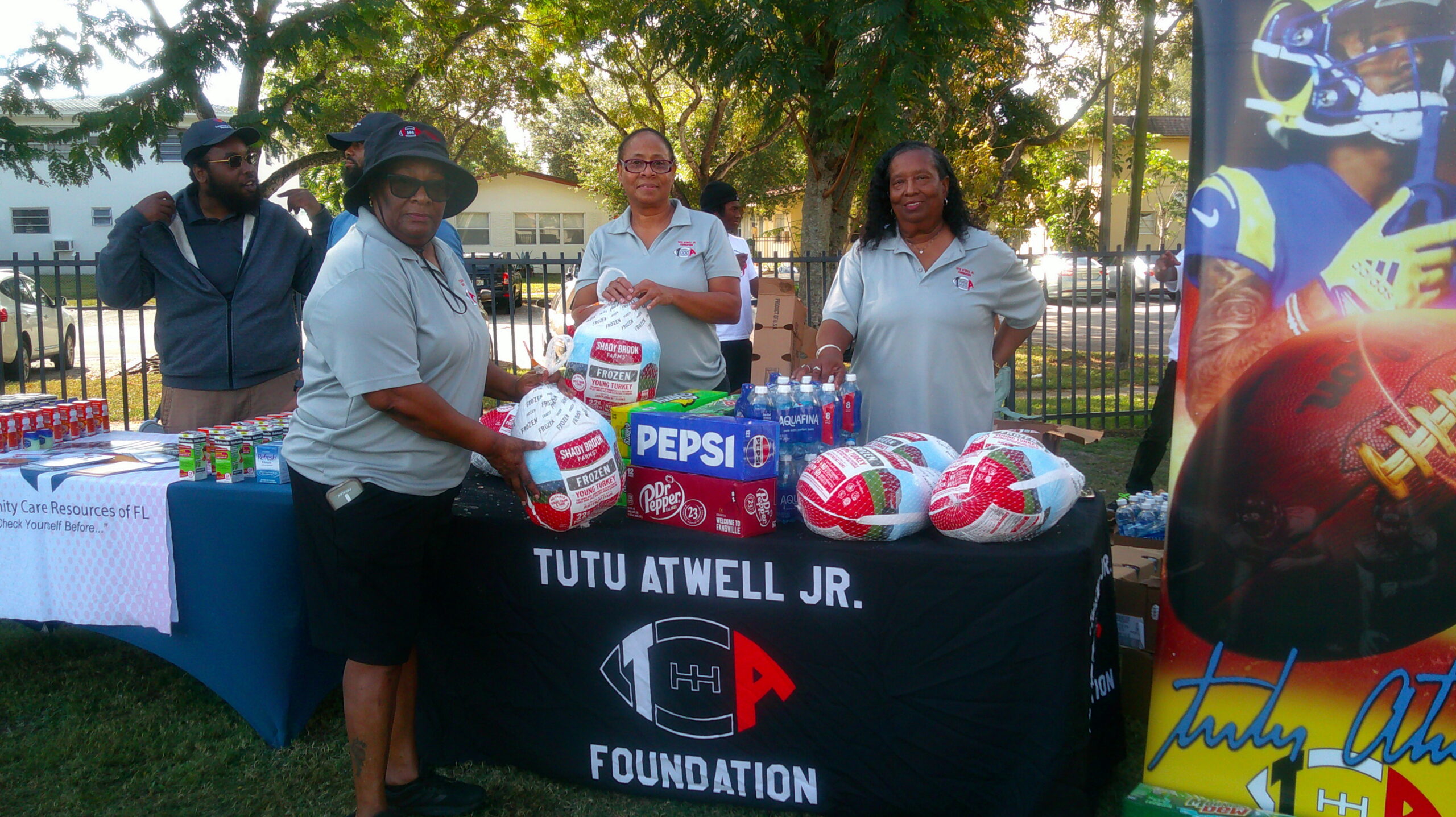 Foundation turkey drive table with food and drinks for families
