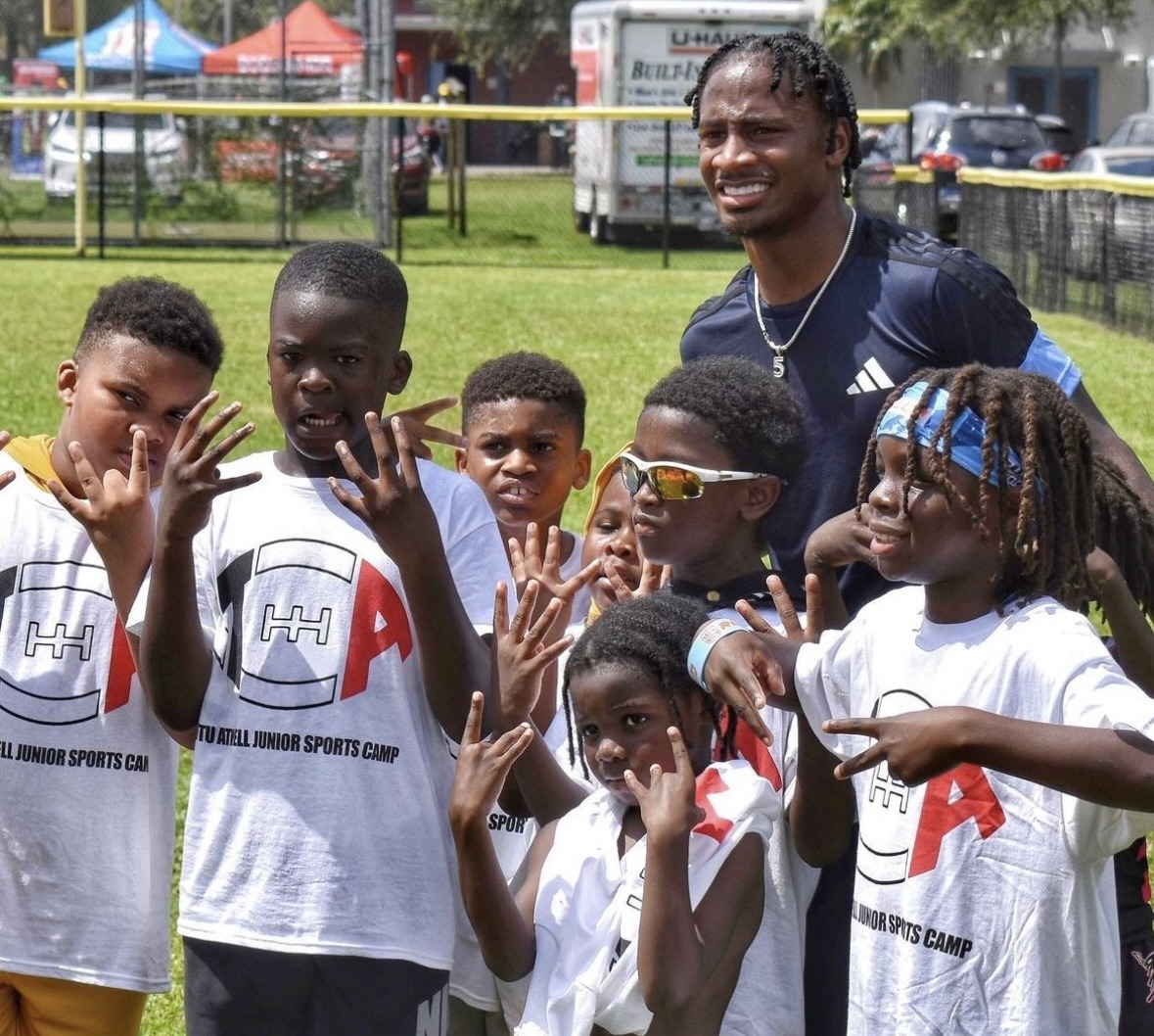 Youth sports camp participants with Tutu Atwell