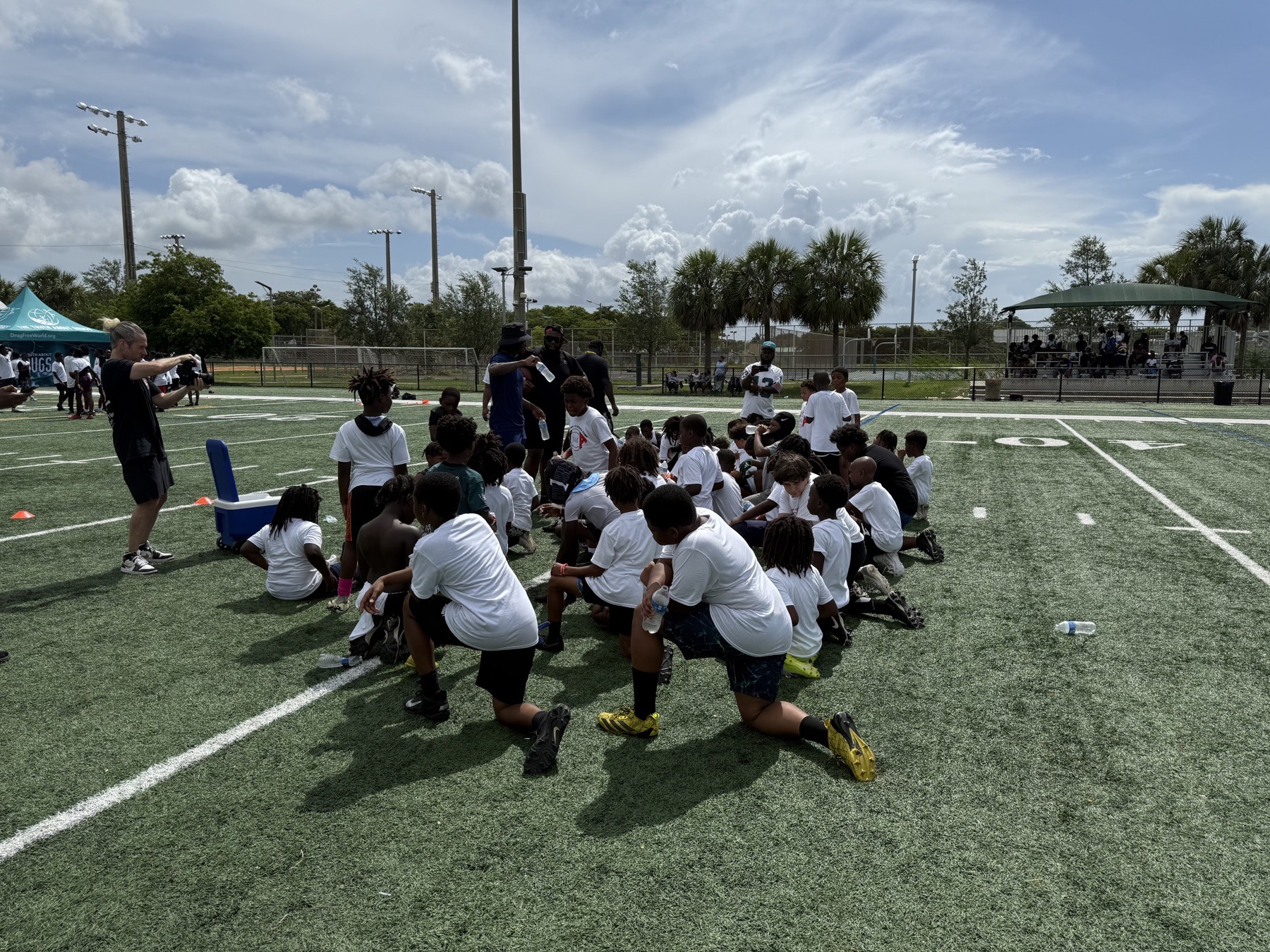 Youth athletes learning teamwork and sportsmanship on the field