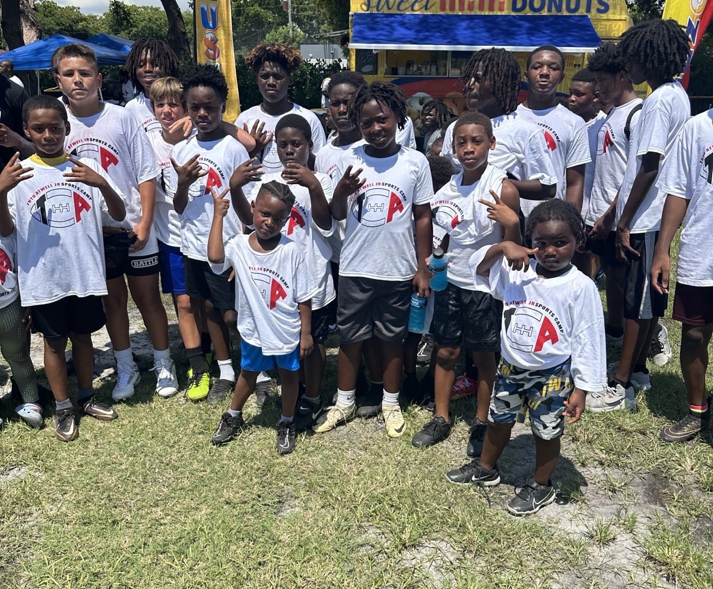 Youth sports camp participants with Tutu Atwell