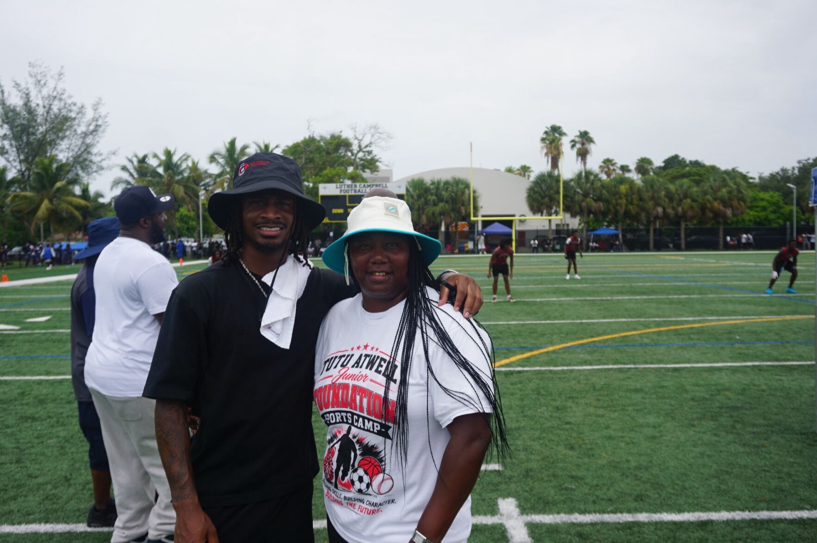 Tutu Atwell with a foundation supporter at the Miami Youth Football Camp and 7-on-7 Invitational