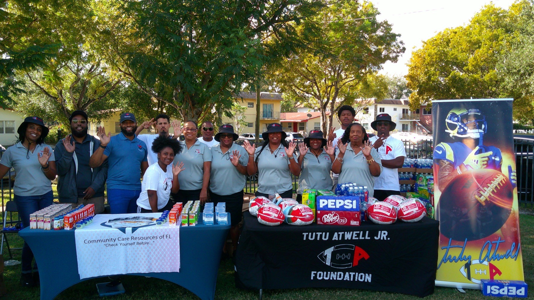 Foundation volunteers and community partners gathered around program supplies
