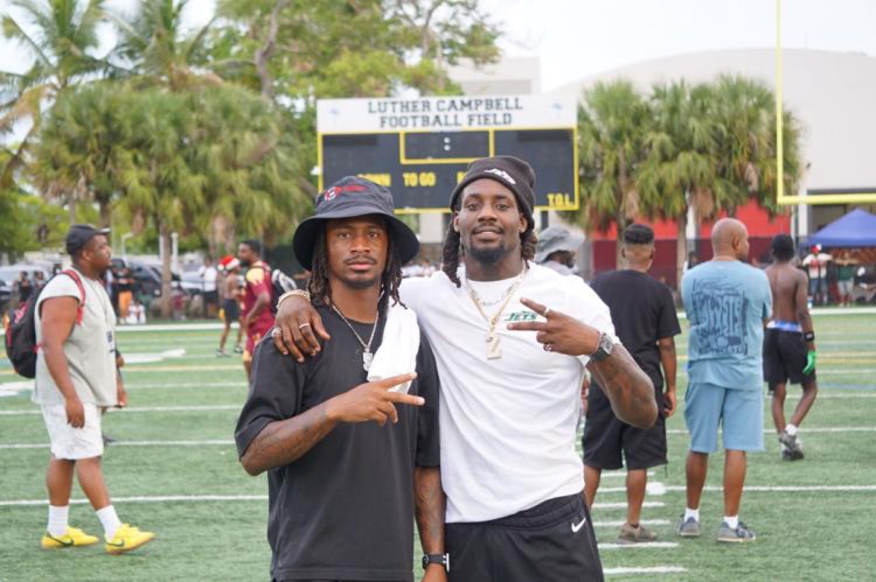 Tutu Atwell with a guest on the field at the 2026 Youth Sports Camp